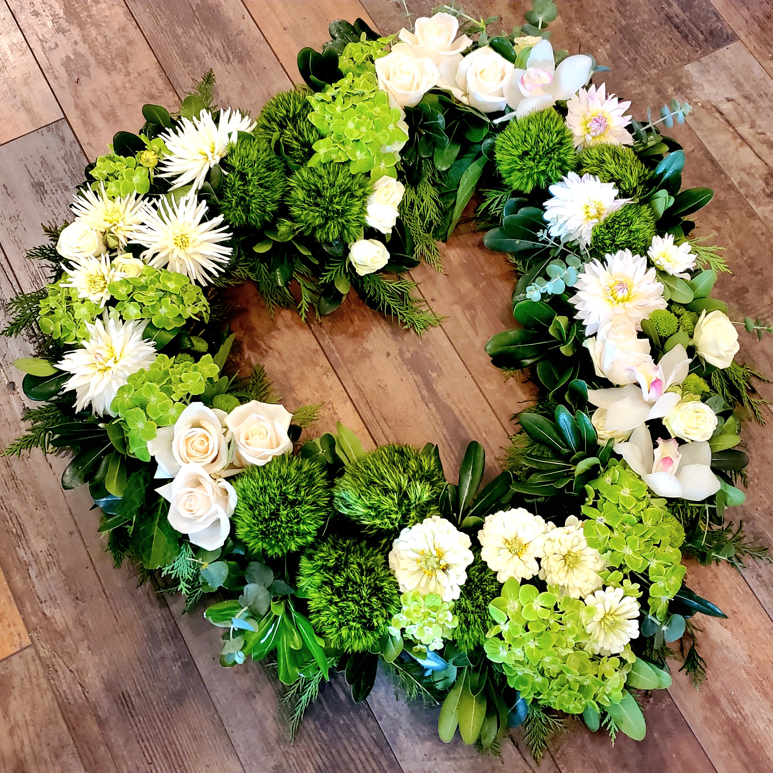 Viridian Heart green floral memorial heart by Reynolds Flowers for sympathy flower delivery in Hanover Massachusetts