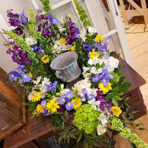 Urn Surround with Purple White Blue Green & Yellow Flower Bouquet