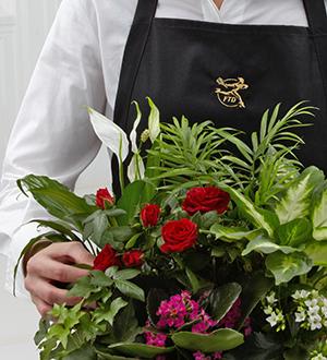 Florist Designed Blooming and Green Plants in a Basket Flower Bouquet