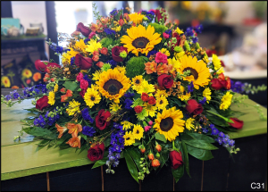 C31 Burst of Color Casket Spray Flower Bouquet