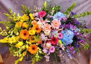 Garden of Sweet Rainbows Casket Spray Flower Bouquet