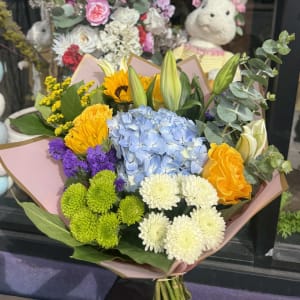 Designer's Choice Bouquet  Wrapped In Colored Paper