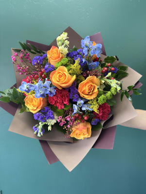 Vibrant Oasis Wrapped By Elite Flower Bouquet