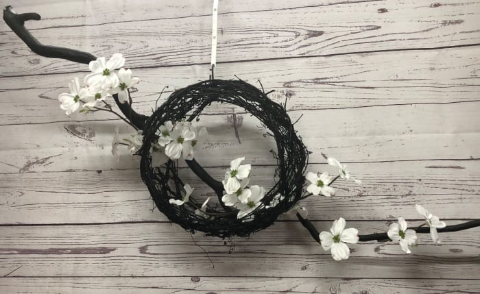 Black Basket Wreath with Silk Dogwood Flowers