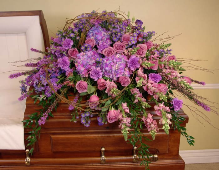 LOVING MEMORIES CASKET SPRAY