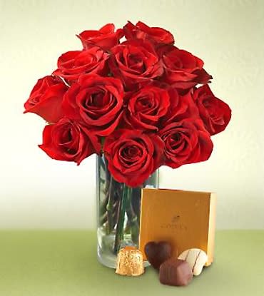 One Dozen Red Roses with a box of premium Chocolates