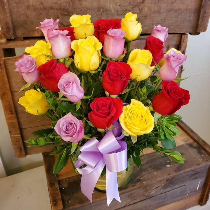 Two Dozen Red Yellow and Lavender Roses Arranged