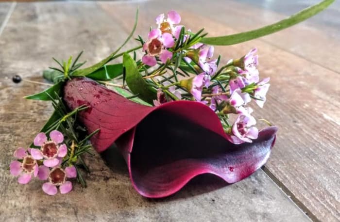 BURGANDY MINI CALLA BOUT WITH WAXFLOWER