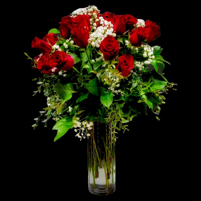 RED ROSES IN CLEAR VASE