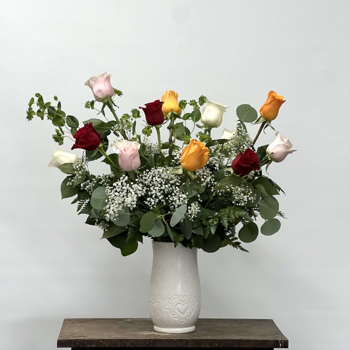 Mixed colored roses arranged in ceramic