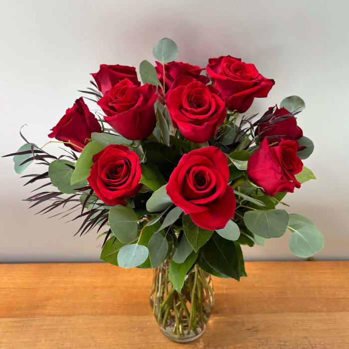 A Dozen Roses Arranged in a Vase