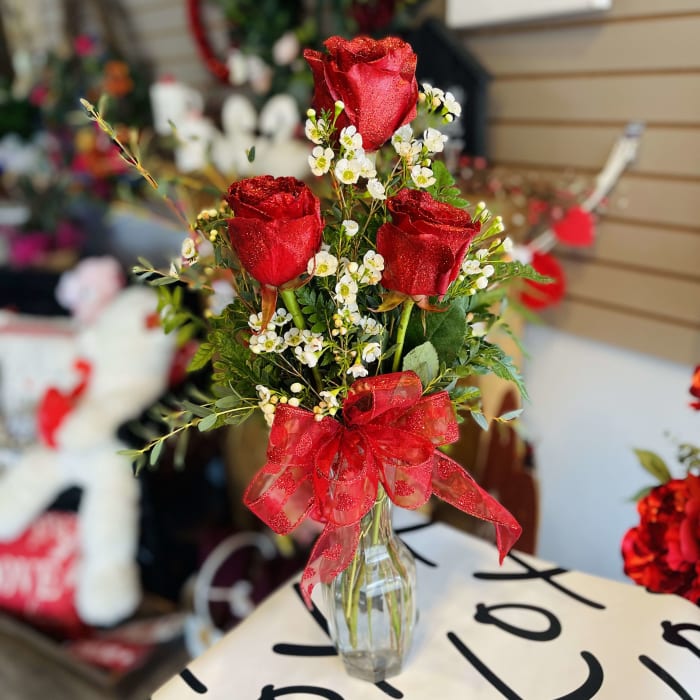 3 Glitter Specialty Red Roses in a budvase