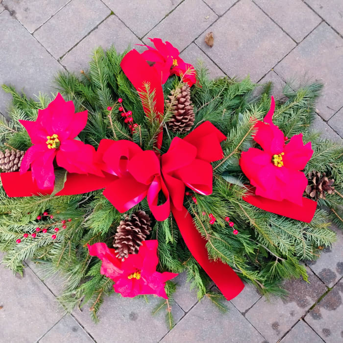 Grave mound with poinsettias