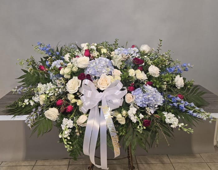 A TOUCH OF RED CASKET SPRAY