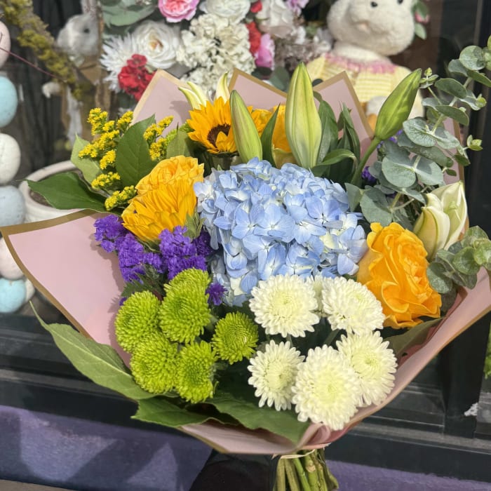 Designer's Choice Bouquet  Wrapped In Colored Paper