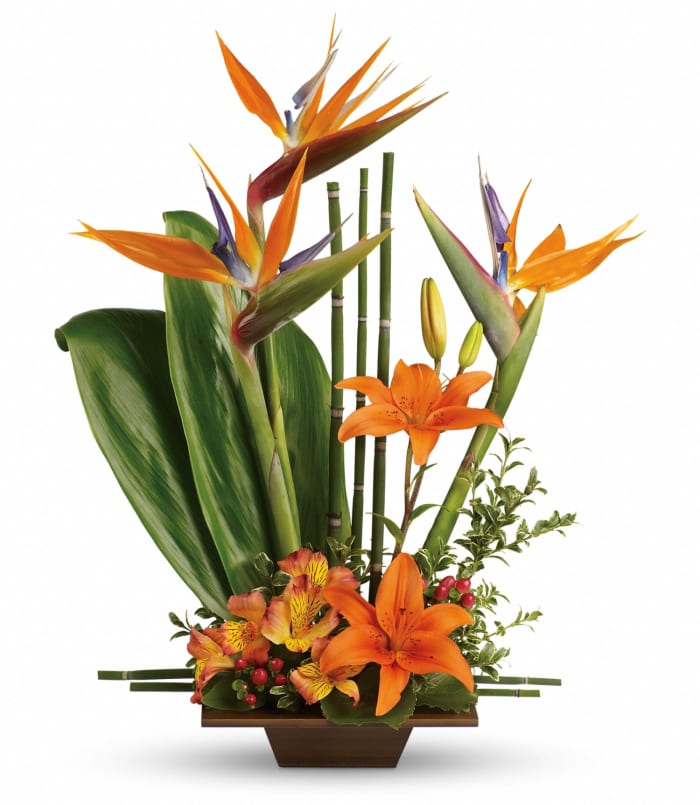 T77-1 Table Arr- asiatic lilies, alstro, b of paradise, hypericum, ti, galax, oregonia, bamboo equis