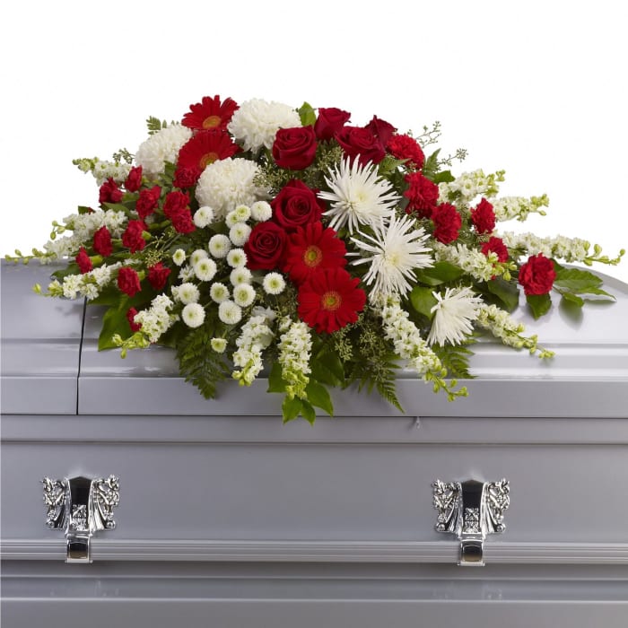 T242-3 Casket spray roses, gerbs, mums,larkspur with greens