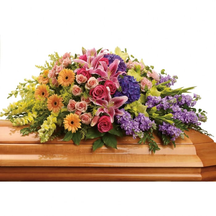T267-4 Casket Spray - hyd, roses, stargazer lilies, mini gerbs, glads, carns, snaps, stock, solidago