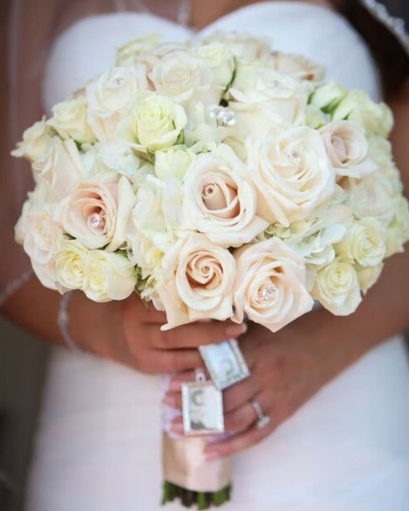Ivory and blush rose bridal bouquet designed by Tropical Arrangements