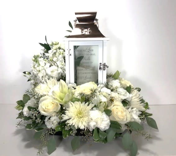 Lantern Surrounded by Flowers