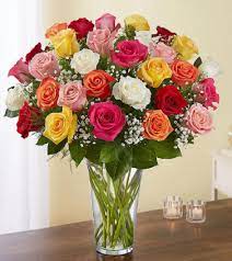 Three Dozen Mixed Color Roses In A Vase