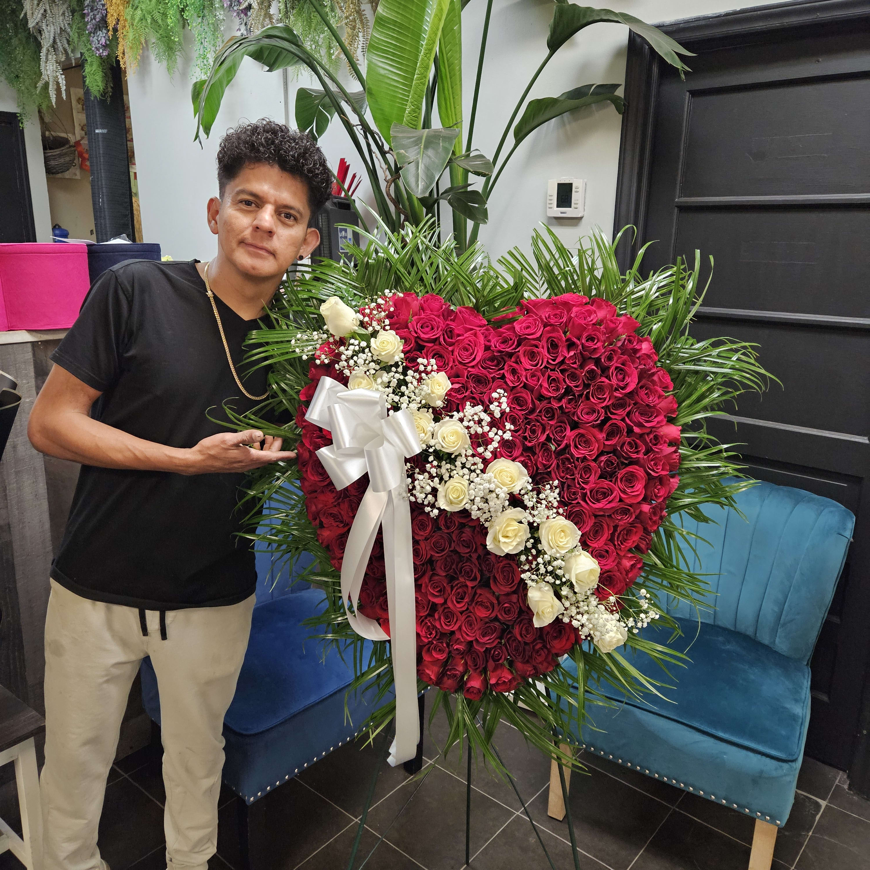 Bleeding Heart Roses with White spray across
