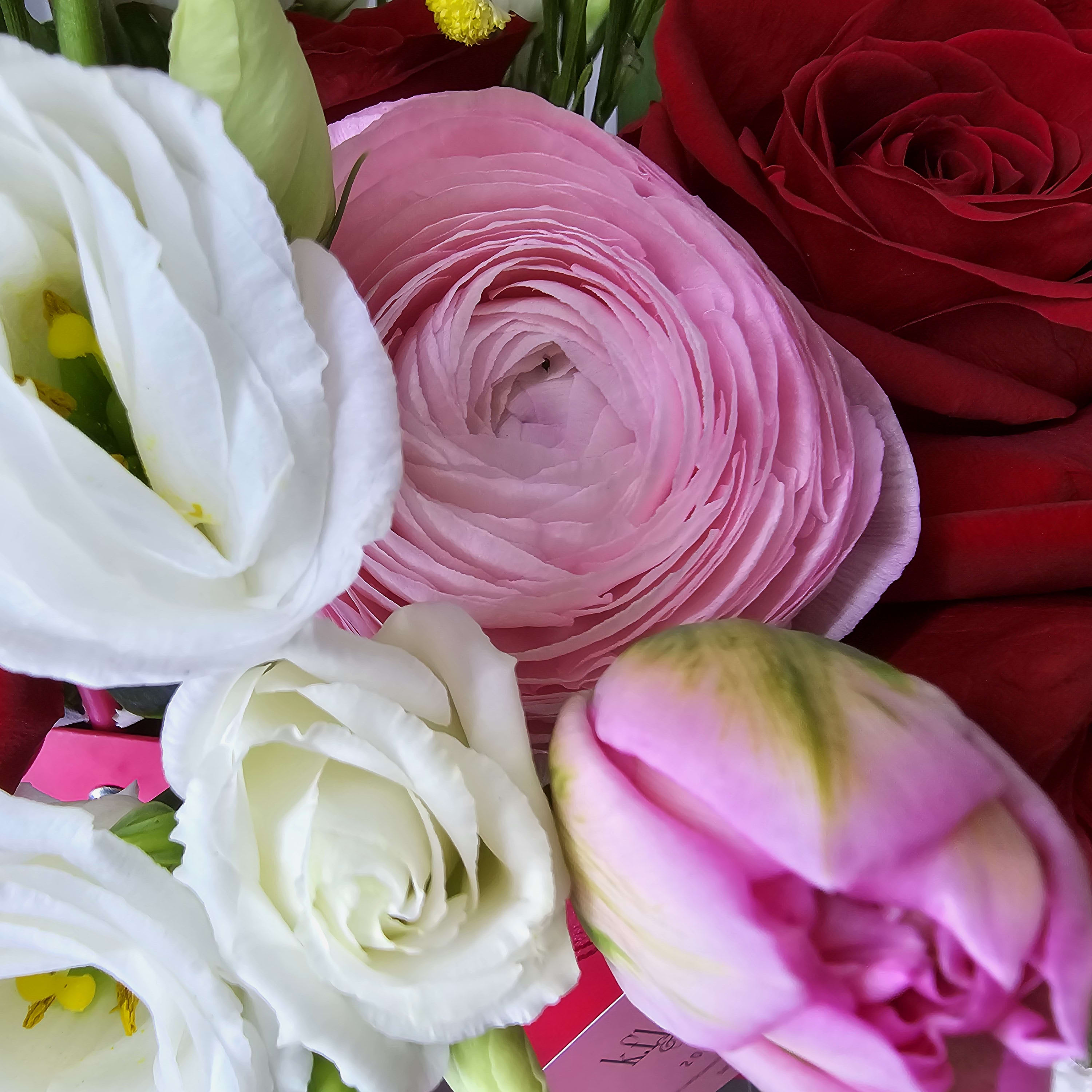 mix arrangement ( red and pink with white flowers)