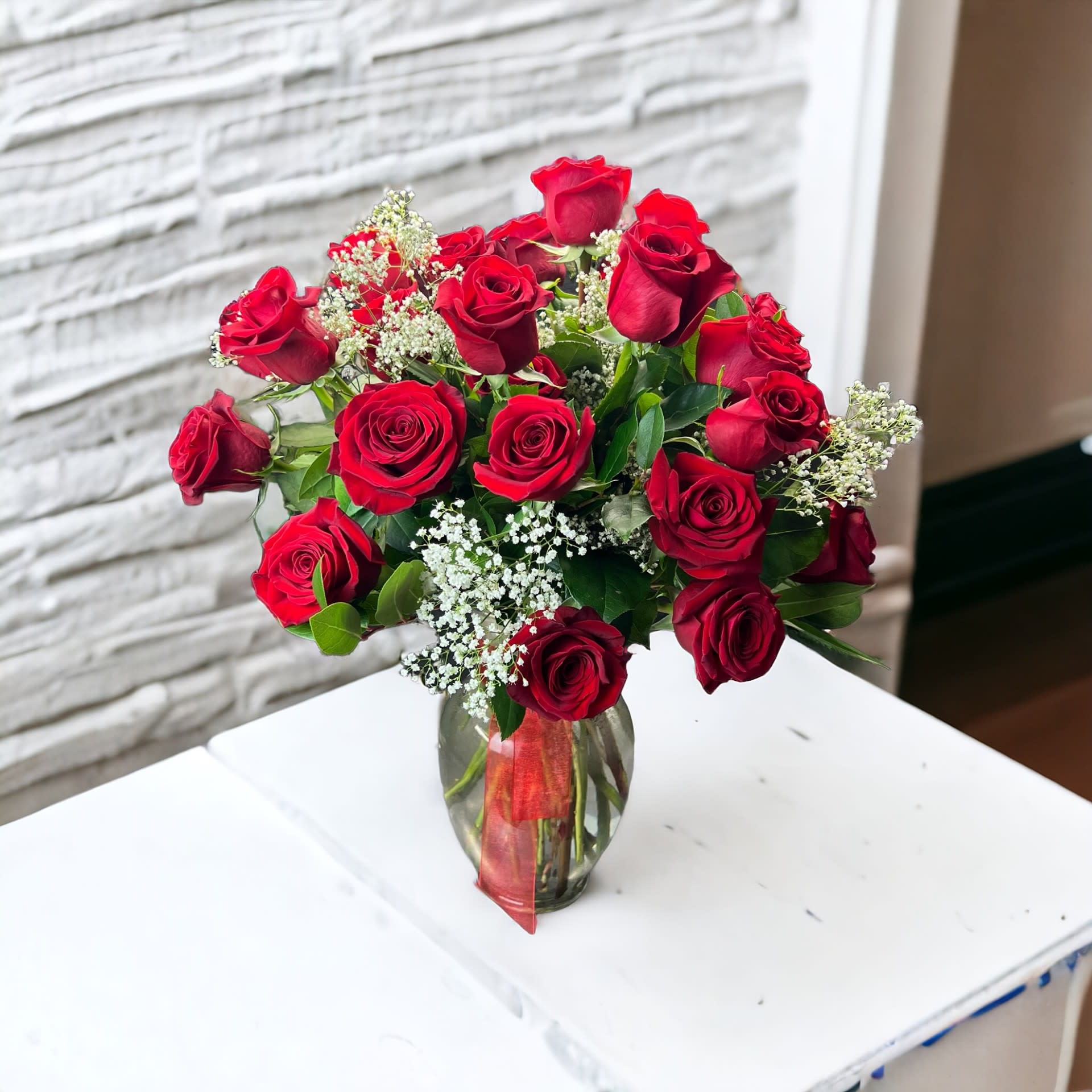 24 Roses arranged in a Vase