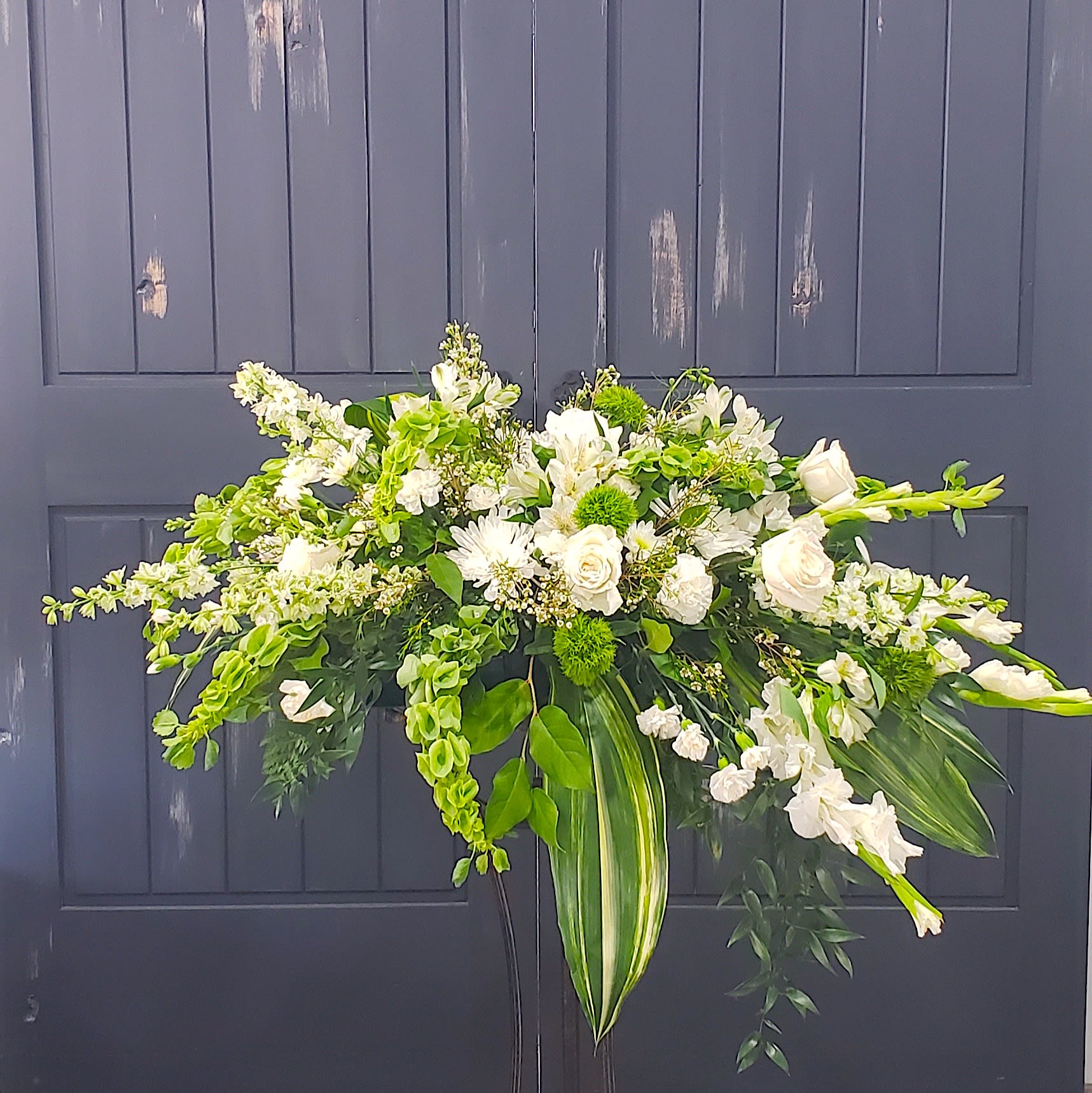 Serene in Green Casket Spray