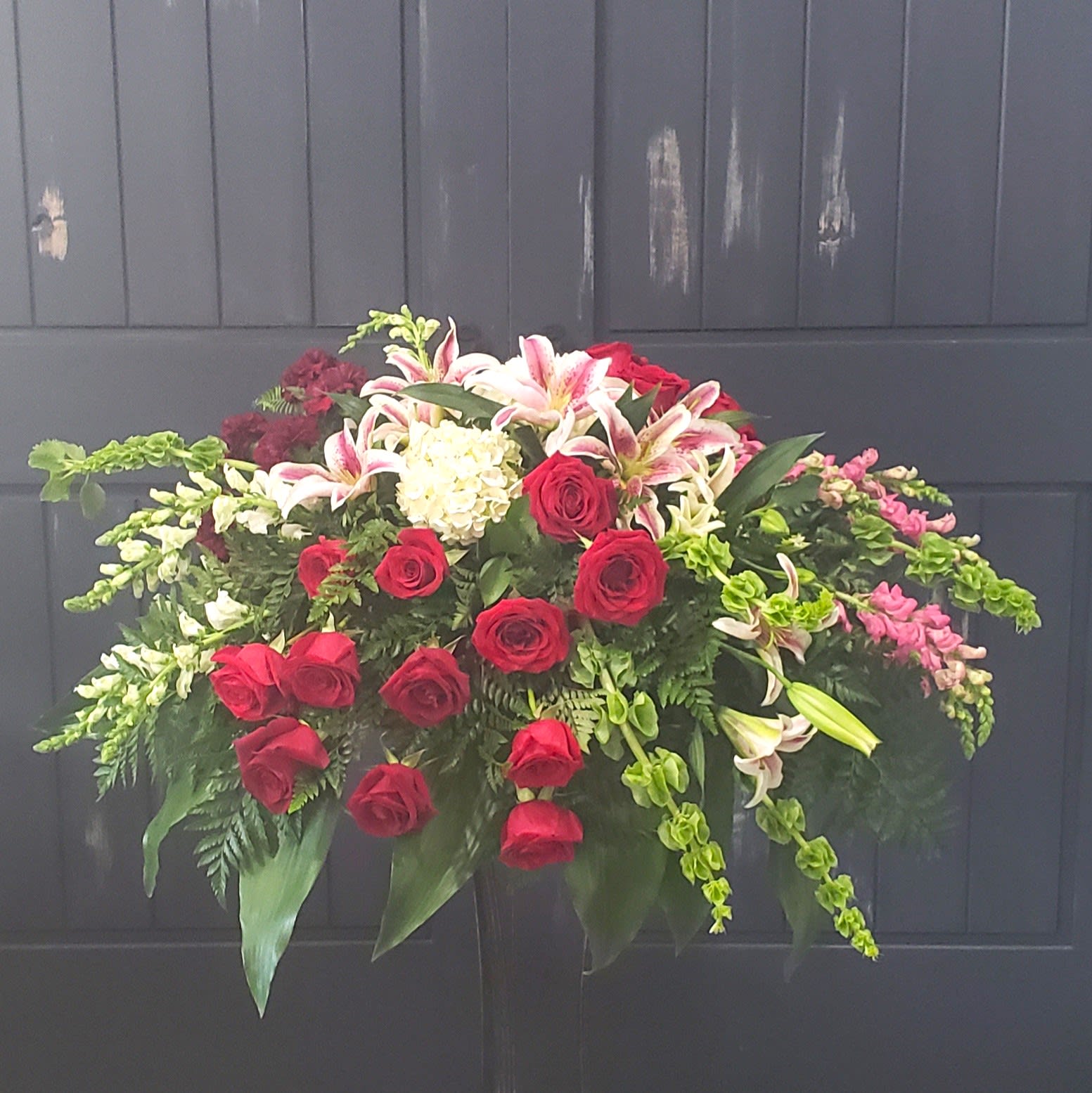 Elegant Adoration,  Roses and Lilies Casket Spray Flower Bouquet