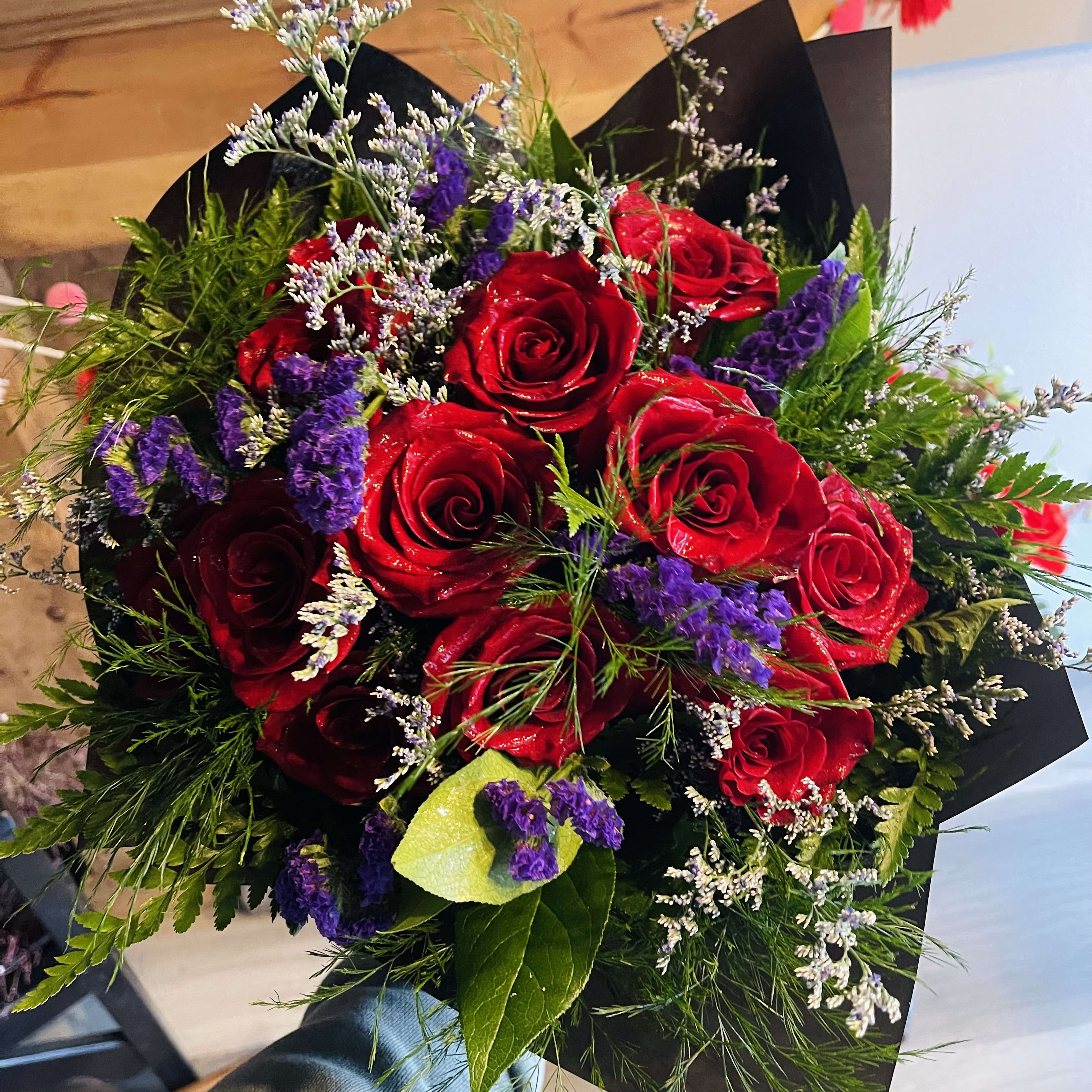 Dozen Red Roses Wrapped in paper