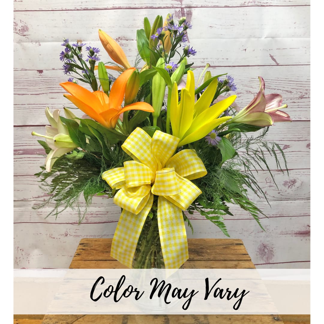 Evolution In Lilies Vased Arrangement Flower Bouquet