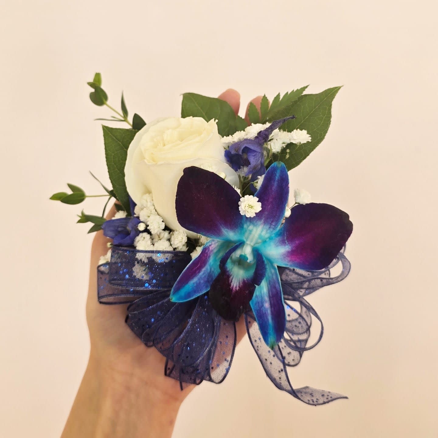 WHITE ROSE & BLUE ORHID CORSAGE