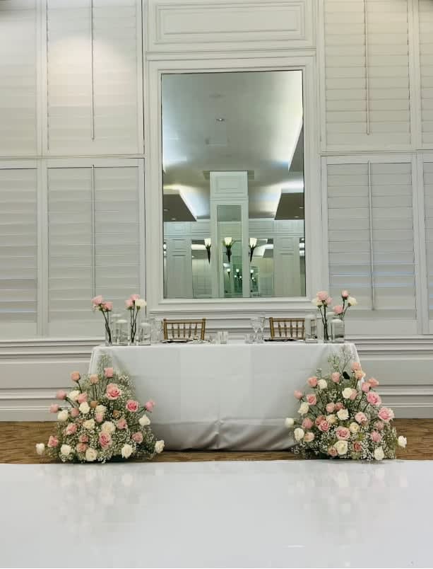Bride and groom table flowers by Tropical Arrangements, Randallstown MD