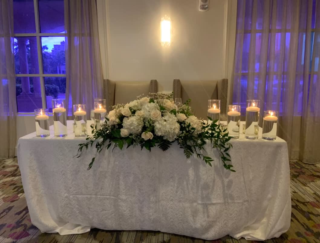 Bride and groom table flowers by Tropical Arrangements, Randallstown MD