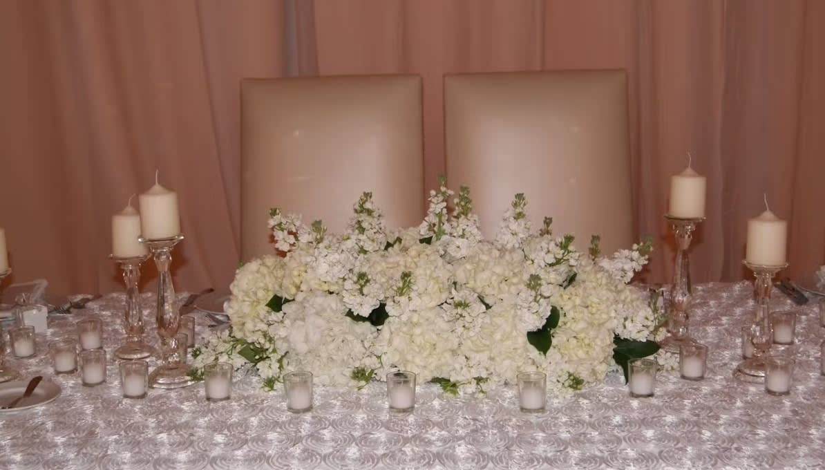 Bride and groom table flowers by Tropical Arrangements, Randallstown MD