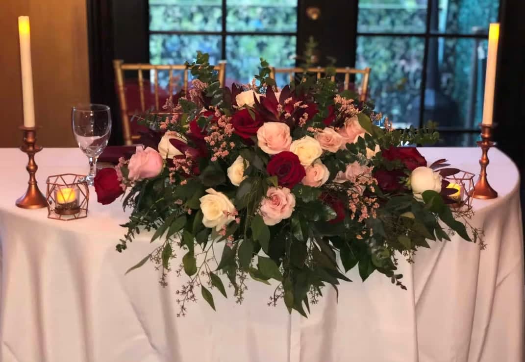 Bride and groom table flowers by Tropical Arrangements, Randallstown MD