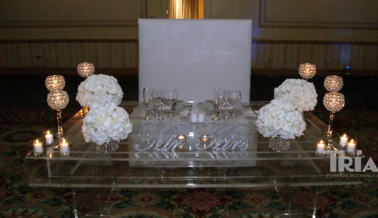Bride and groom table flowers by Tropical Arrangements, Randallstown MD
