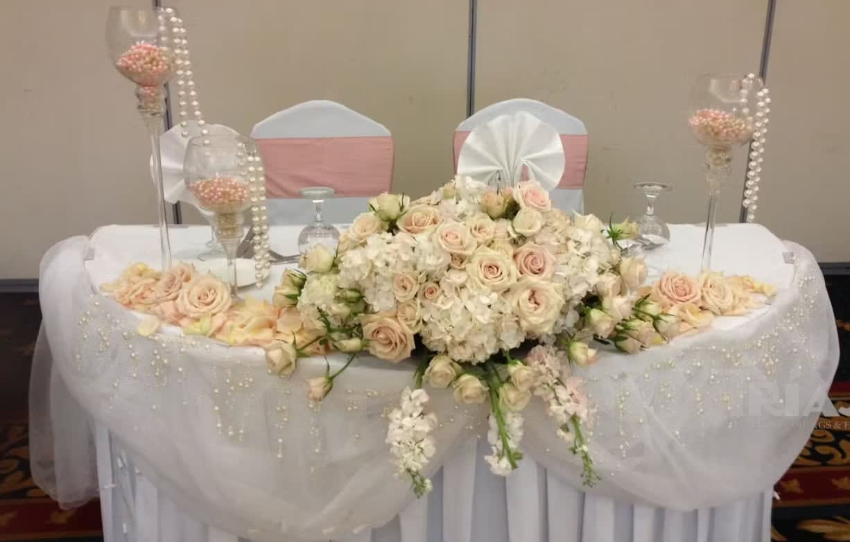Bride and groom table flowers by Tropical Arrangements, Randallstown MD
