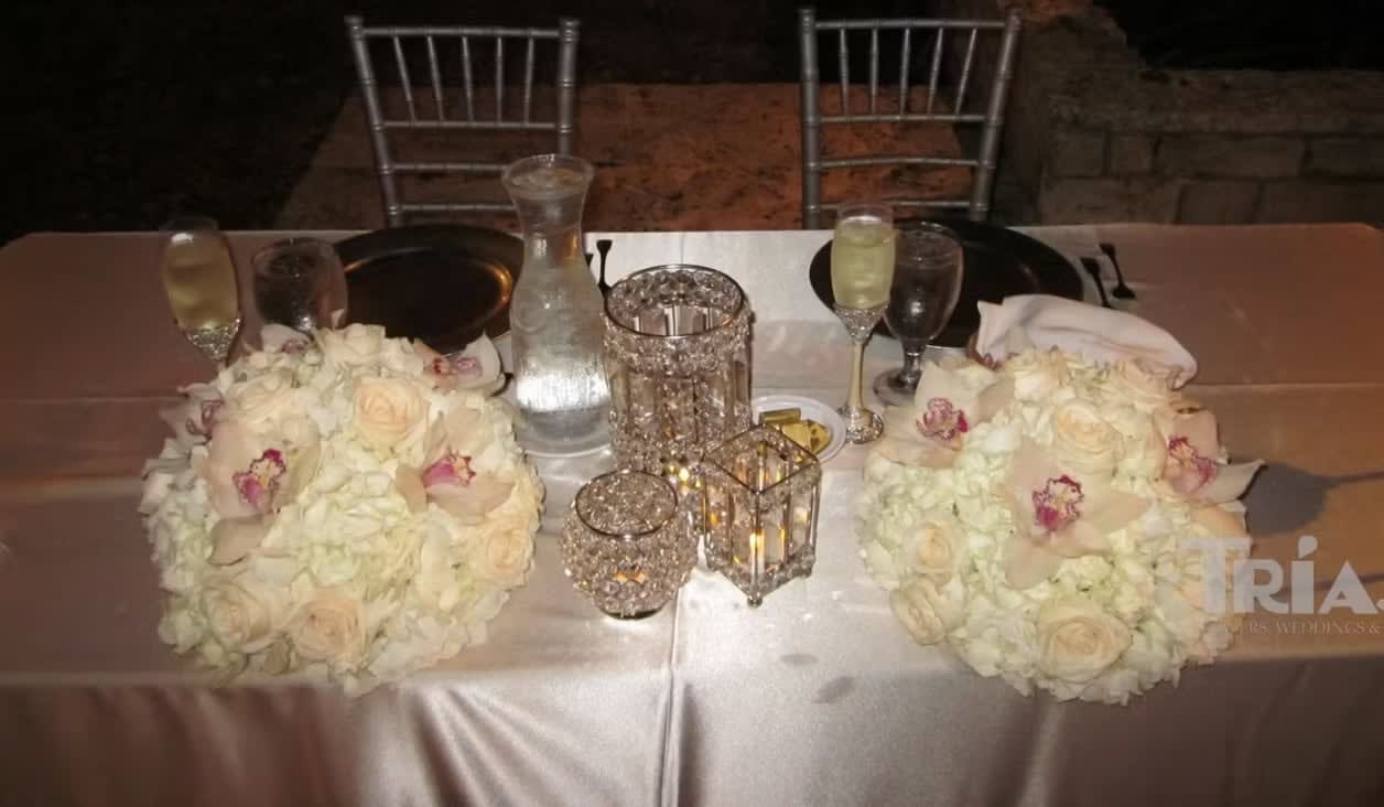 Bride and groom table flowers by Tropical Arrangements, Randallstown MD