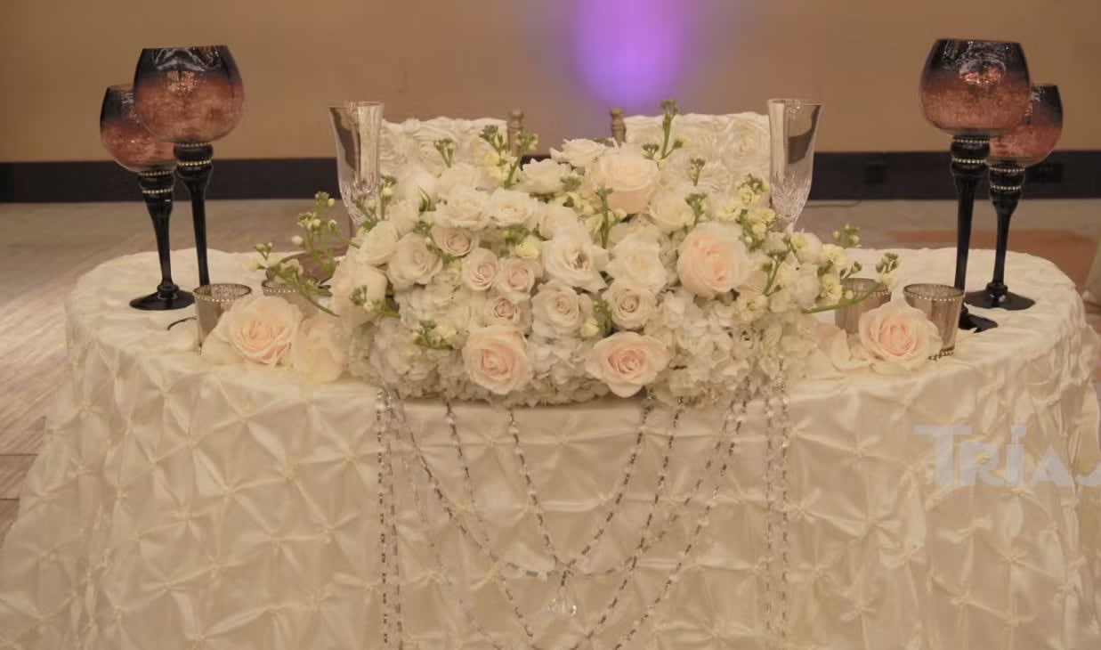 Bride and groom table flowers by Tropical Arrangements, Randallstown MD