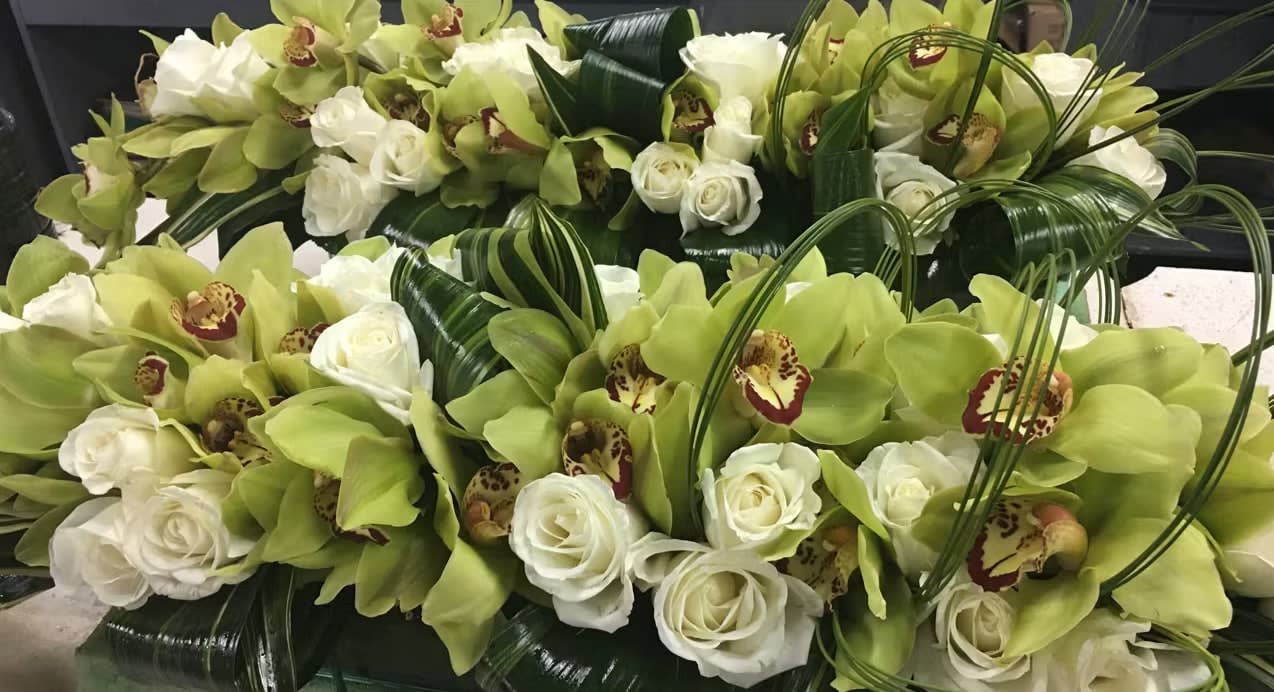 Bride and groom table flowers by Tropical Arrangements, Randallstown MD