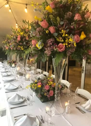 Bride and groom table flowers by Tropical Arrangements, Randallstown MD