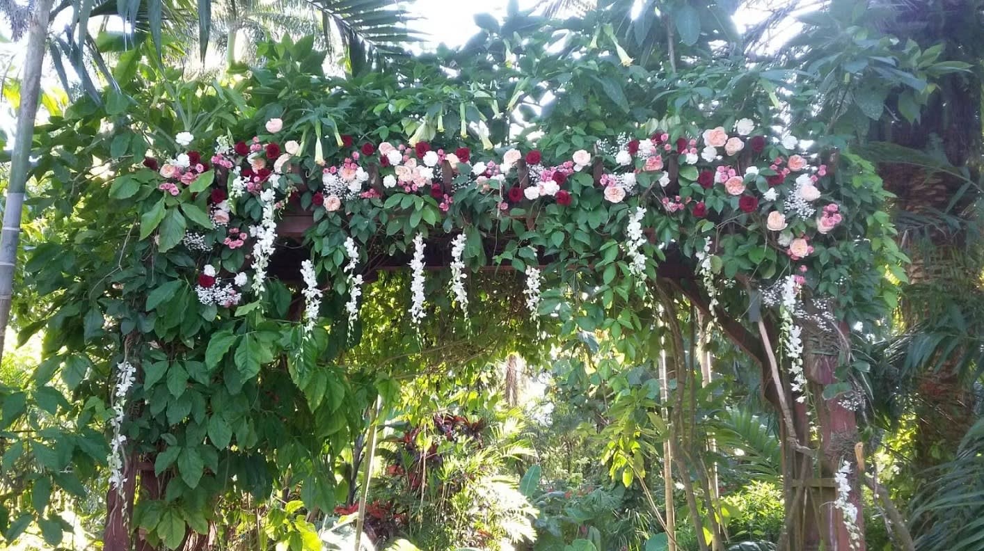 Wedding arch and altar flowers by Tropical Arrangements, Randallstown MD