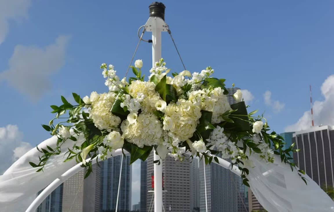Wedding arch and altar flowers by Tropical Arrangements, Randallstown MD
