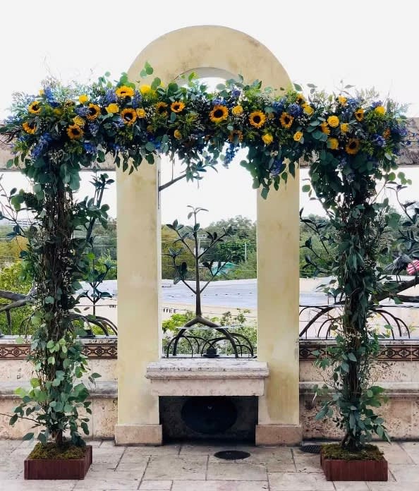 Wedding arch and altar flowers by Tropical Arrangements, Randallstown MD