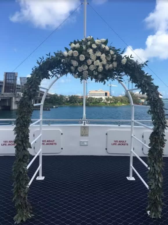 Wedding arch and altar flowers by Tropical Arrangements, Randallstown MD