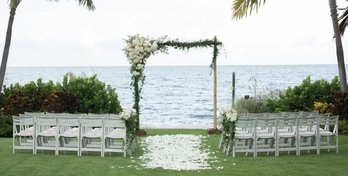 Wedding arch and altar flowers by Tropical Arrangements, Randallstown MD