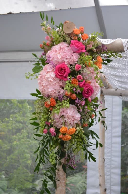 Wedding arch and altar flowers by Tropical Arrangements, Randallstown MD