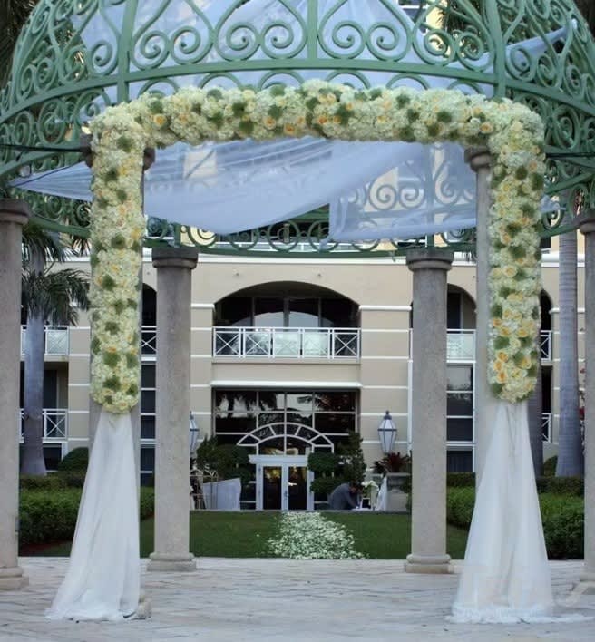 Wedding arch and altar flowers by Tropical Arrangements, Randallstown MD